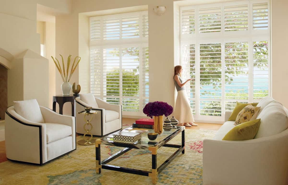 Custom living room window treatments near La Quinta, California (CA) including Palm Beach™ Polysatin™ Shutters.