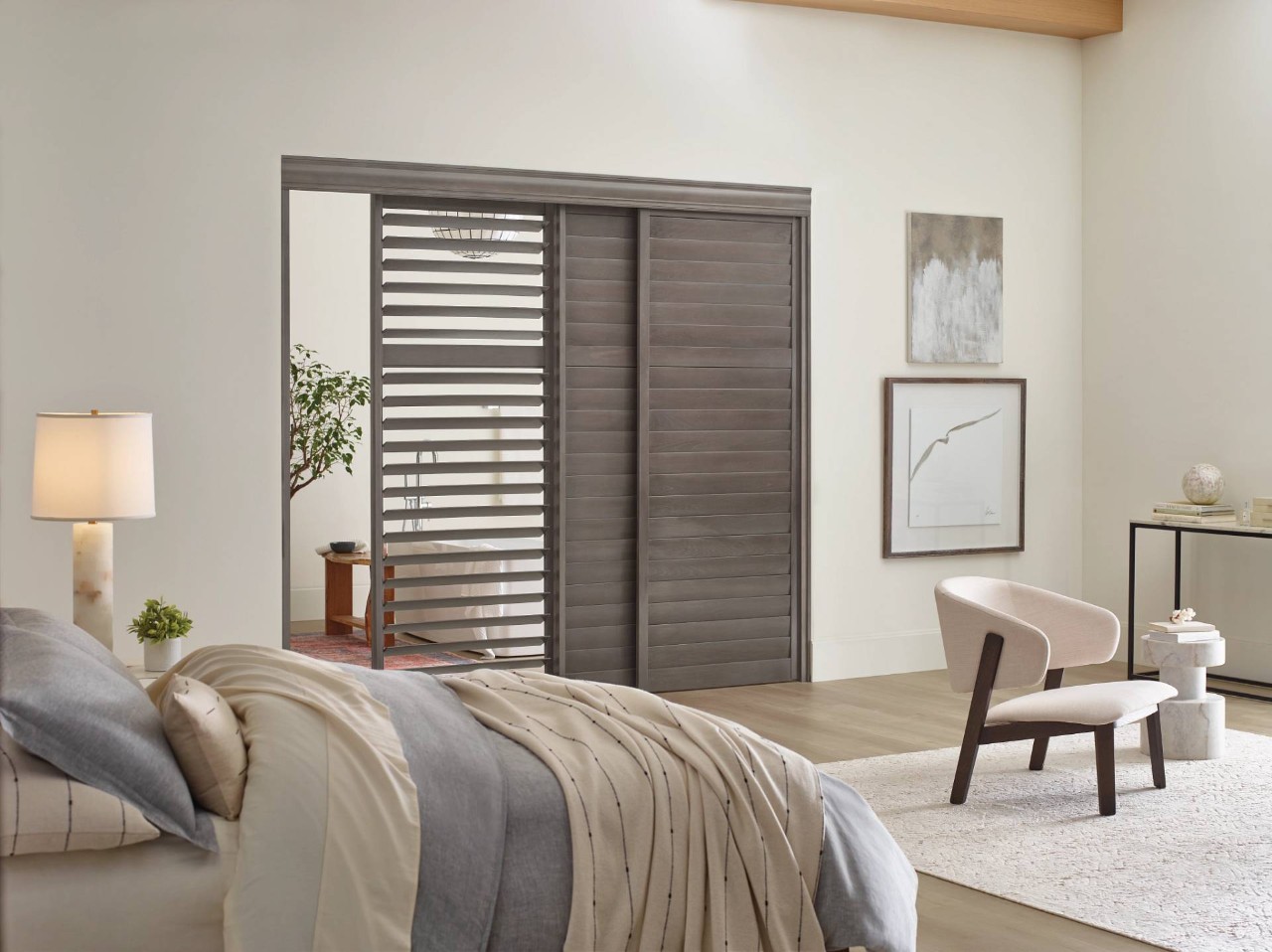 Hunter Douglas Heritance® Wood Shutters in a bedroom near La Quinta, CA
